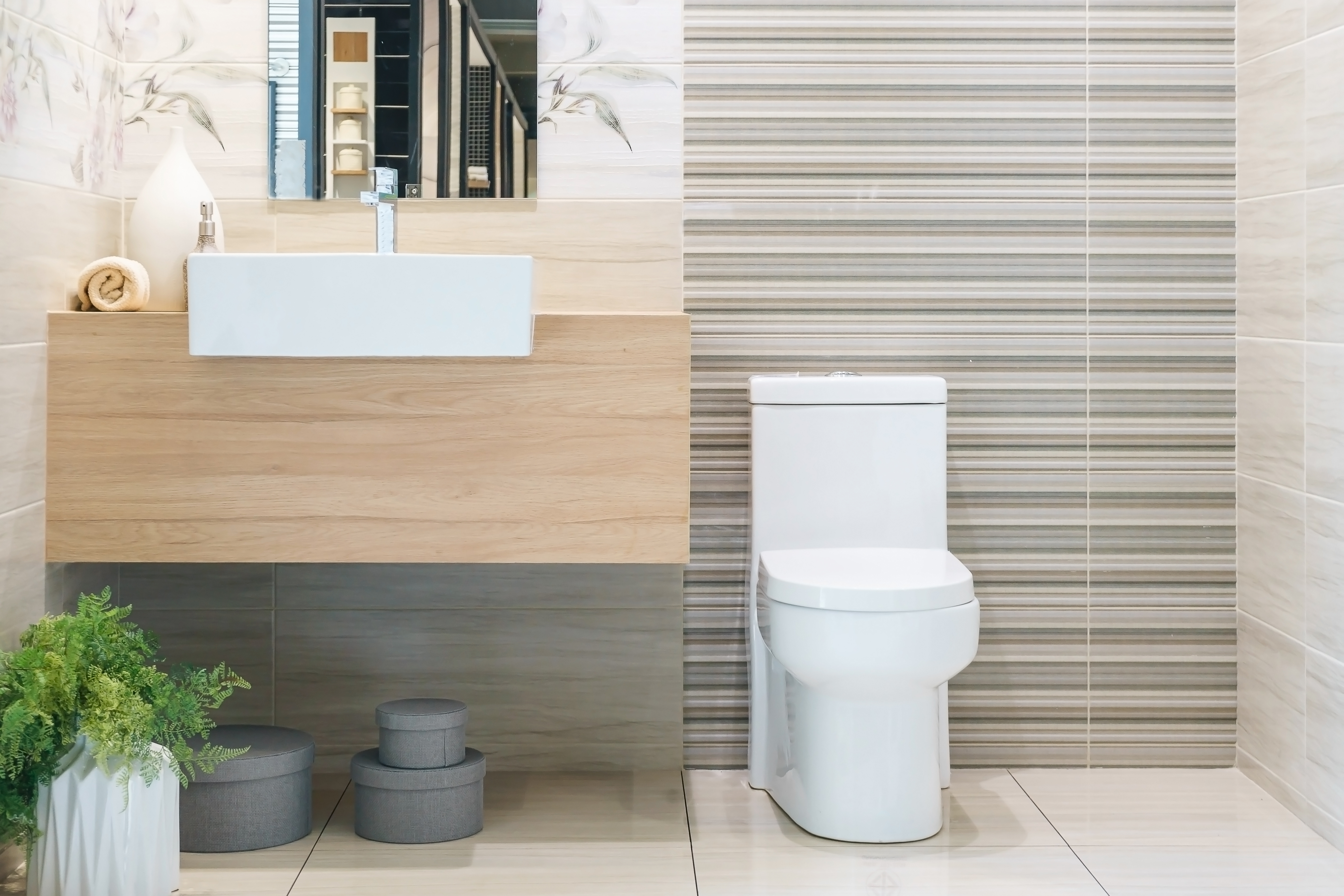 A modern toilet in a nice bathroom that can benefit from Laughlin Electric septic tank repair in Santa Barbara, CA.